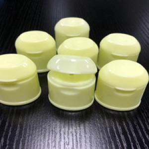 In mold closing flip-top cap mold 